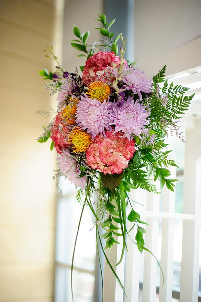 Purple, Coral and Pink Wedding Ceremony Flowers